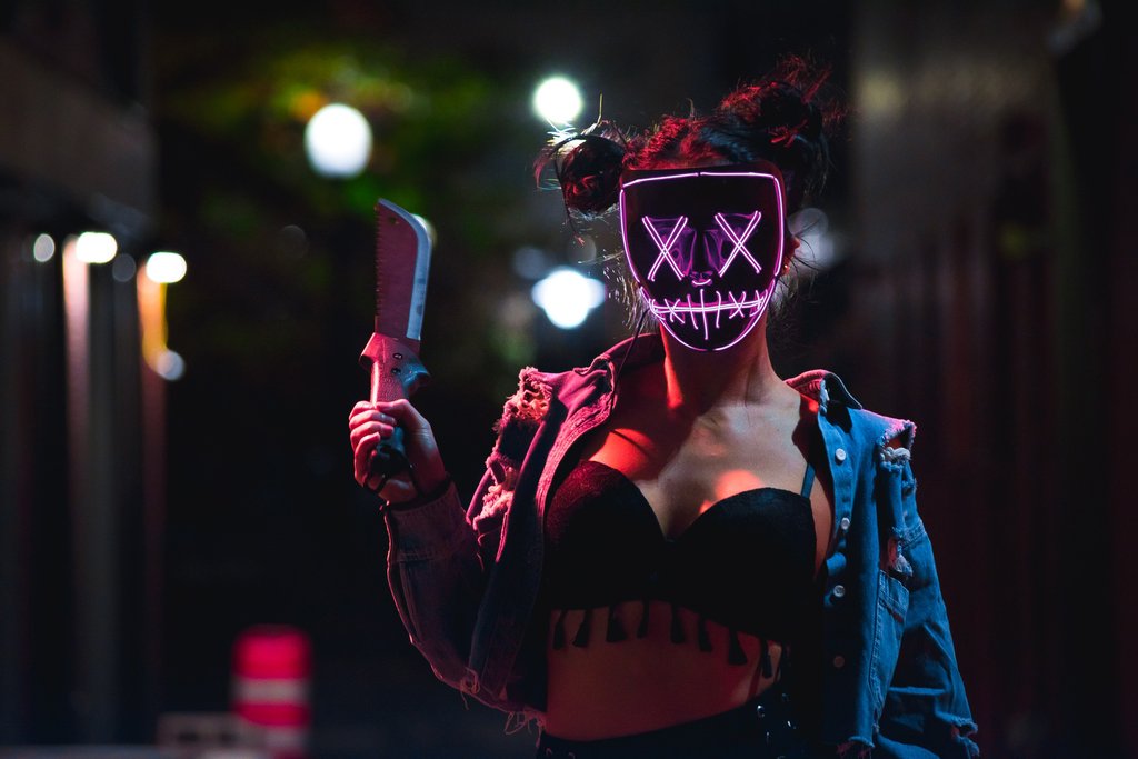 girl with a led purge mask pink